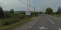 Panou publicitar stradal pe drum principal, zonă rezidențială, județul Bistrița-Năsăud